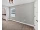 Cozy bedroom with an en-suite bathroom, window with blinds, and neutral carpet flooring, perfect for relaxation and privacy at 3027 W Spruce St, Tampa, FL 33607