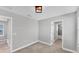 Spacious bedroom featuring neutral walls, carpet flooring, and an en-suite bathroom, perfect for creating a tranquil retreat at 3027 W Spruce St, Tampa, FL 33607