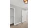 A spacious bedroom features a neutral palette with carpet and a view of a closet at 3027 W Spruce St, Tampa, FL 33607