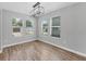 Bright dining room with hardwood floors and large windows at 3027 W Spruce St, Tampa, FL 33607