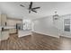 Open-concept kitchen with granite countertops, stainless steel appliances, and tile backsplash at 3027 W Spruce St, Tampa, FL 33607