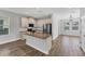 Modern kitchen featuring granite countertops, stainless steel appliances, and a large island at 3027 W Spruce St, Tampa, FL 33607