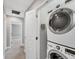 Convenient laundry area with modern, stacked washer and dryer at 3027 W Spruce St, Tampa, FL 33607