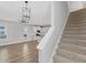 Open concept living area with access to kitchen, dining and stairs at 3027 W Spruce St, Tampa, FL 33607