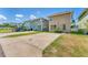 Rear exterior view showing paved driveways and backyard space at 3027 W Spruce St, Tampa, FL 33607