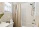Bathroom features neutral decor, tiled shower, and a showerhead with detachable sprayer at 3404 W Villa Rosa St, Tampa, FL 33611
