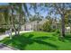 Charming home with a well-manicured front lawn and welcoming curb appeal and an inviting driveway at 3404 W Villa Rosa St, Tampa, FL 33611