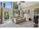 Bright living room with large windows, comfortable sofas, and a decorative rug at 3404 W Villa Rosa St, Tampa, FL 33611