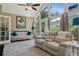 Bright living room with vaulted ceilings, large windows, sectional couch, and comfortable seating at 3404 W Villa Rosa St, Tampa, FL 33611