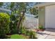 Landscaped side yard and white picket fence create curb appeal at 3404 W Villa Rosa St, Tampa, FL 33611