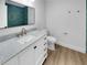 Bathroom featuring a marble vanity top, modern fixtures, and a blue-tiled shower at 3410 Grove Street Cir, Tampa, FL 33610
