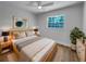 Comfortable bedroom featuring ample natural light, ceiling fan, and neutral decor at 3410 Grove Street Cir, Tampa, FL 33610