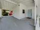 Large carport offering ample parking and an entryway that enhances the home's curb appeal at 3410 Grove Street Cir, Tampa, FL 33610