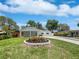 Inviting home with a manicured lawn and mature landscaping enhancing curb appeal at 3410 Grove Street Cir, Tampa, FL 33610