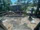 Outdoor deck area with a view of the backyard, surrounded by lush trees and greenery at 359 S Orchid Dr, Ellenton, FL 34222
