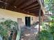 A covered back deck with an open door and a lot of stuff at 359 S Orchid Dr, Ellenton, FL 34222