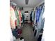 Walk-in closet with clothing racks and shelving, providing ample storage space at 359 S Orchid Dr, Ellenton, FL 34222