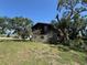 A two-story home surrounded by mature trees at 359 S Orchid Dr, Ellenton, FL 34222