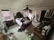 A main bedroom boasting a ceiling fan, dark wood furniture and an ensuite bathroom at 359 S Orchid Dr, Ellenton, FL 34222