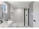 This bright bathroom features new fixtures, white tile, and a shower at 3926 Helena Ne St, St Petersburg, FL 33703