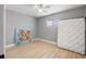 Bedroom with ceiling fan, modern flooring, and a minimalist decor for a serene atmosphere at 3926 Helena Ne St, St Petersburg, FL 33703