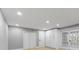 Bright bedroom with modern flooring, recessed lighting, and ample closet space for storage and organization at 3926 Helena Ne St, St Petersburg, FL 33703