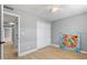 Cozy bedroom with a ceiling fan, closet, and a bright painting adds a touch of art to the space at 3926 Helena Ne St, St Petersburg, FL 33703