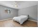 This bedroom features a ceiling fan and a window with a backyard view at 3926 Helena Ne St, St Petersburg, FL 33703