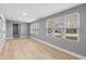 Spacious living room features large windows, sleek floors, and neutral paint throughout the space at 3926 Helena Ne St, St Petersburg, FL 33703
