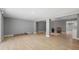 Expansive open living area with modern flooring, recessed lighting, and open access to multiple rooms at 3926 Helena Ne St, St Petersburg, FL 33703