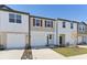 Attractive townhome exteriors with well-maintained landscaping at 4243 Banjo Lake Rd, Land O Lakes, FL 34639