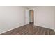 Bedroom with new floors and a door leading to the hallway at 6426 Eden Ln, Tampa, FL 33634