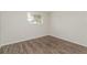 Bright bedroom with new floors and a window offering natural light at 6426 Eden Ln, Tampa, FL 33634