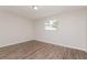 Bright bedroom with new floors and a window offering natural light at 6426 Eden Ln, Tampa, FL 33634