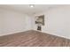 Inviting living room with durable flooring and a glimpse into the adjacent modern kitchen at 6426 Eden Ln, Tampa, FL 33634