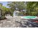 A refreshing backyard oasis with pool, patio, and screened pool house at 6503 N Wellington Ave, Tampa, FL 33604