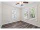 Bedroom with light colored walls, hardwood floors, and natural lighting at 6503 N Wellington Ave, Tampa, FL 33604