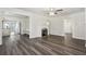 Living room with hardwood floors, fireplace, and open floor plan at 6503 N Wellington Ave, Tampa, FL 33604