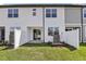 Inviting backyard featuring a well-maintained lawn, a cozy patio, and privacy fence, perfect for outdoor living at 7288 Deer Valley Circle, Tampa, FL 33635