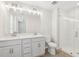 Modern bathroom boasts double vanity, a glass-enclosed shower, and natural light, creating a spa-like experience at 7288 Deer Valley Circle, Tampa, FL 33635