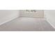 Bright bedroom with gray carpeting, natural light, and neutral walls at 7288 Deer Valley Circle, Tampa, FL 33635