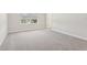 Bedroom with gray carpet, natural light, and neutral paint at 7288 Deer Valley Circle, Tampa, FL 33635