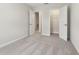 Neutrally decorated bedroom featuring plush gray carpet, white trim, and open doorways to nearby rooms and closet at 7288 Deer Valley Circle, Tampa, FL 33635