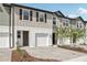 Desirable townhouses offering one-car garages, neutral color schemes, and landscaped front yards at 7288 Deer Valley Circle, Tampa, FL 33635