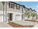 Inviting townhouse exteriors with a neutral color palette, a one-car garage, and landscaped front yards at 7288 Deer Valley Circle, Tampa, FL 33635