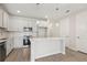Stylish kitchen with white cabinets, an island, updated appliances, and recessed lighting at 7288 Deer Valley Circle, Tampa, FL 33635
