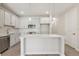 Modern kitchen with stainless steel appliances, a kitchen island, and plenty of cabinet space at 7288 Deer Valley Circle, Tampa, FL 33635