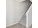 Bright staircase features carpeted steps, white risers, and natural light, providing a clean and modern transition between floors at 7288 Deer Valley Circle, Tampa, FL 33635