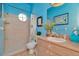 Well-lit bathroom featuring a walk-in shower with beige tile and stylish seashell decor at 14680 Linden Dr, Spring Hill, FL 34609