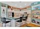 Bright kitchen with stainless steel appliances, tiled backsplash, pendant lighting, and bar stool seating at 14680 Linden Dr, Spring Hill, FL 34609